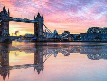 Water reflection of London Tower Bridge at sunset