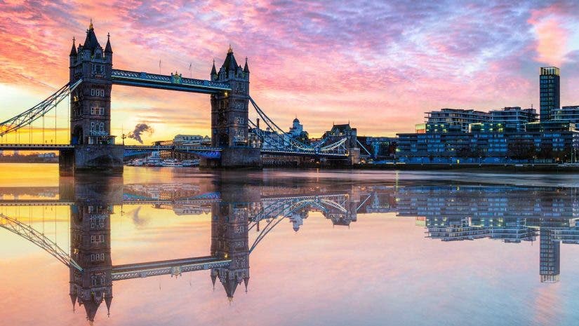 Water reflection of London Tower Bridge at sunset