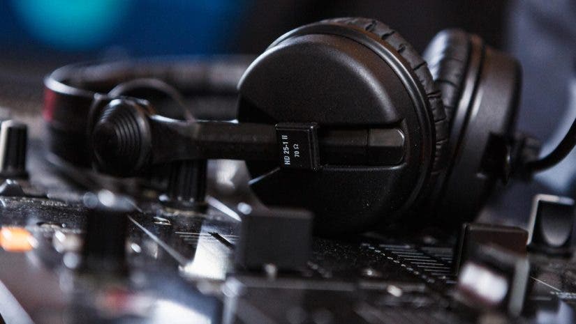 Black Sennheiser DJ headphones on mixer