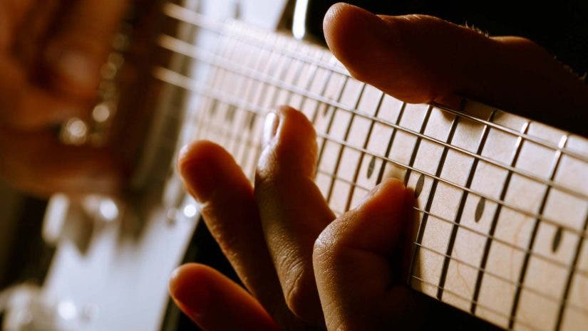 guitar playing stratocaster fingers on fretboard