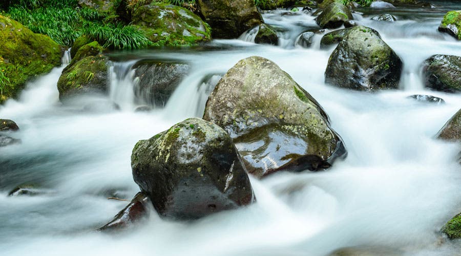 Effect of neutral density ND camera lens filter on slow shutter image of flowing water