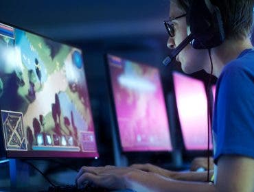 Video game player wearing headset with microphone