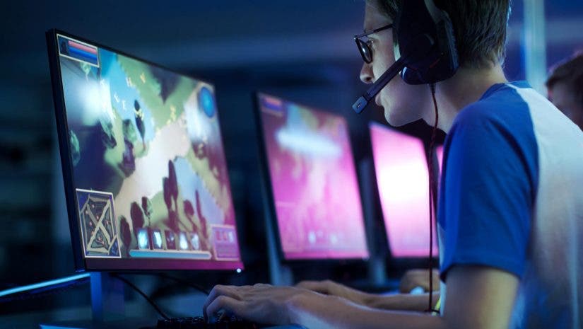 Video game player wearing headset with microphone