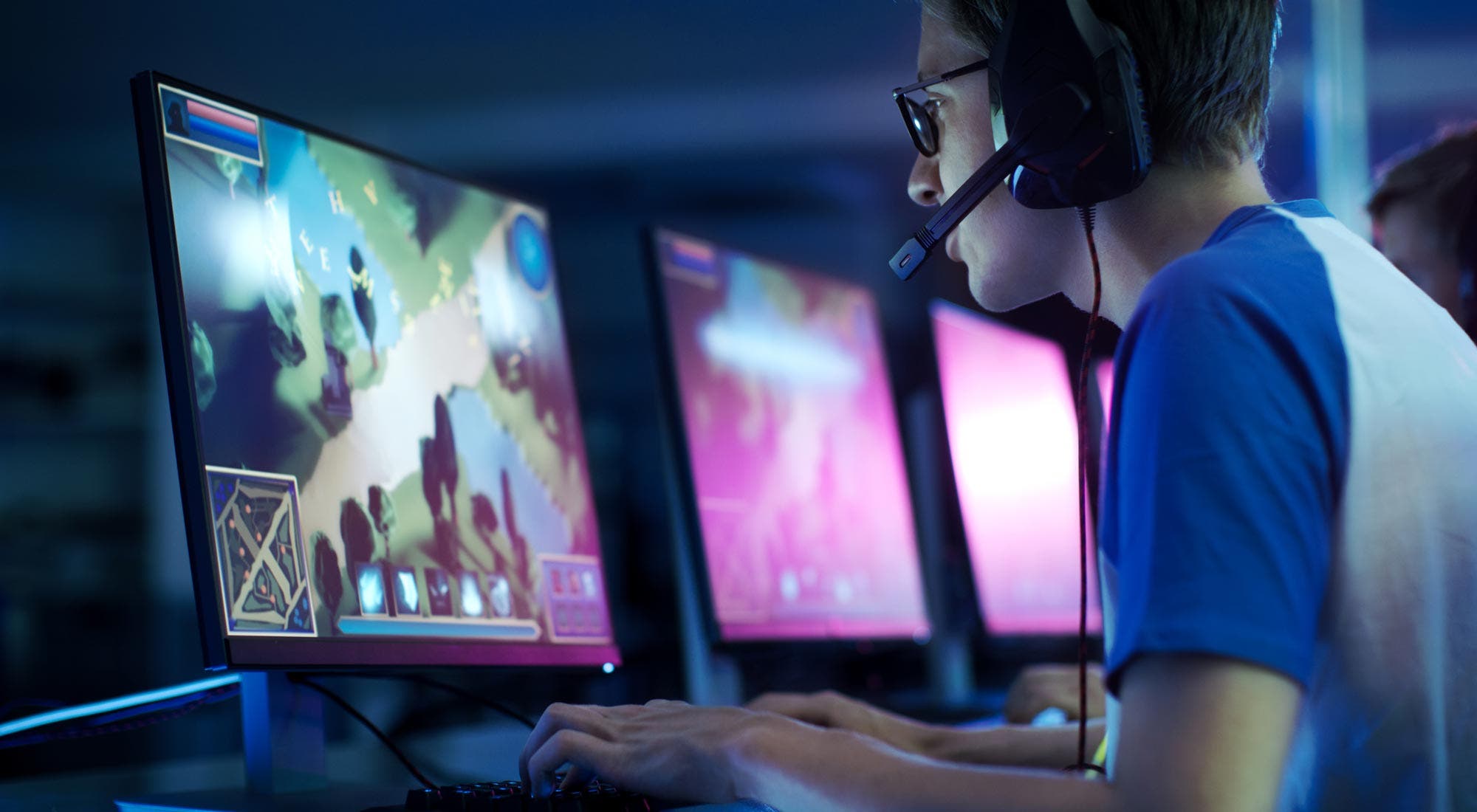 Video game player wearing headset with microphone
