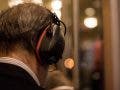 Man with noise-canceling headphones on train