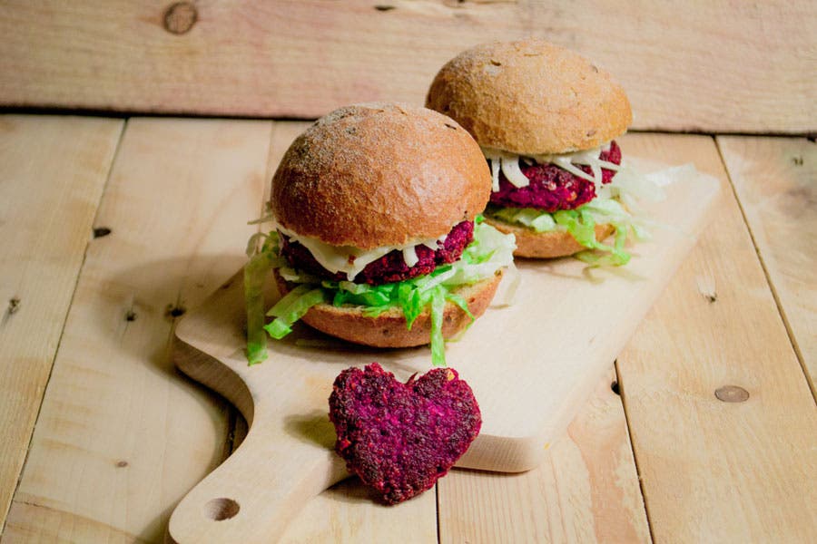Wide shot of burgers on chopping board