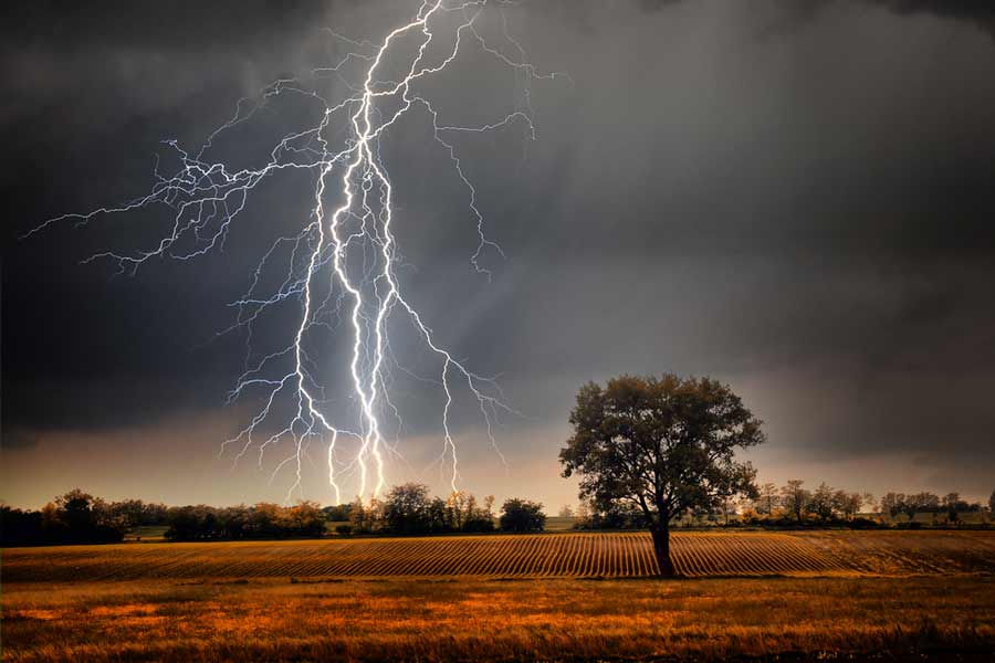 weather photography shot of lightning over a field