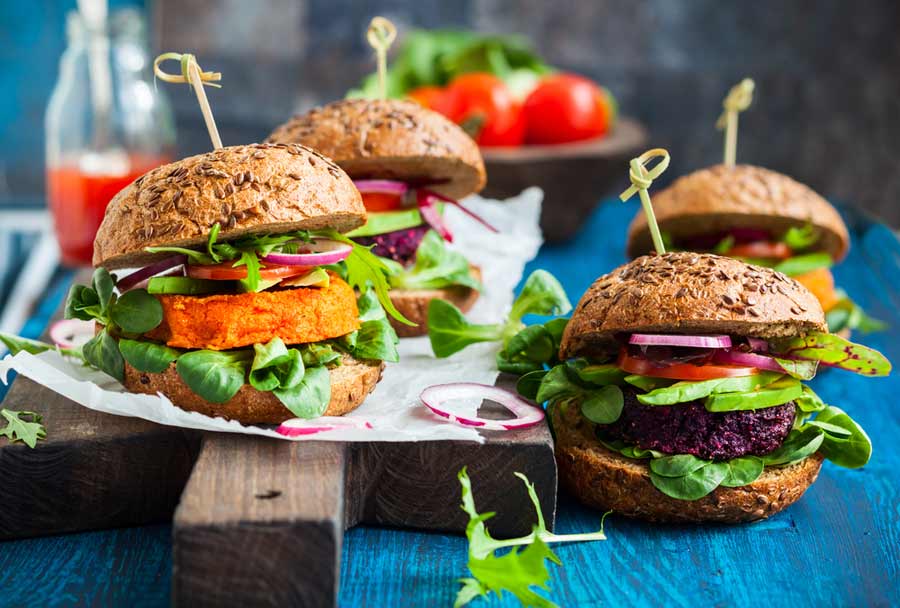 food photography shot of four burgers