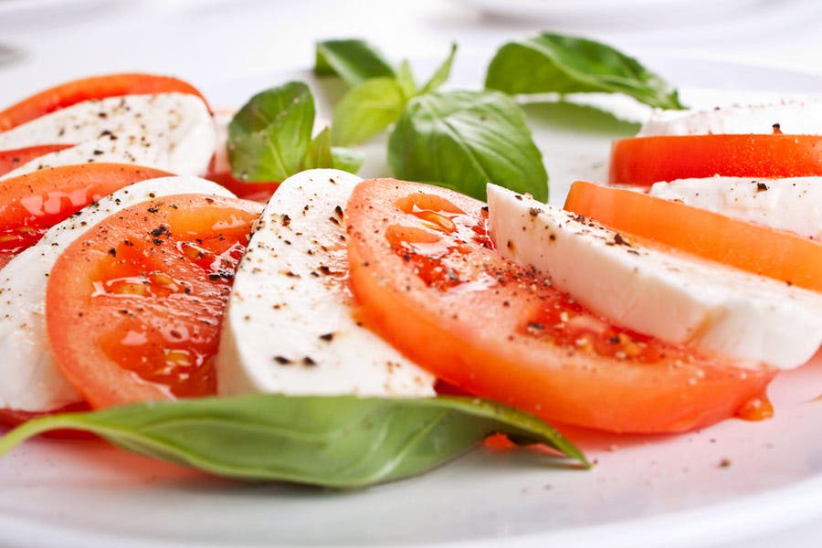 Macro shot of sliced tomatoes and cheese