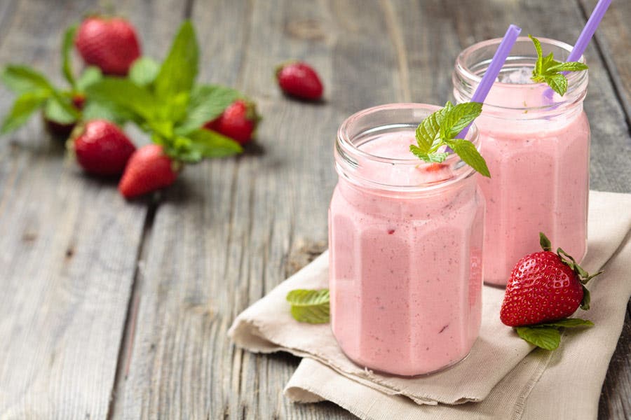 shot of strawberry milkshakes in jars using tilt-shift lens
