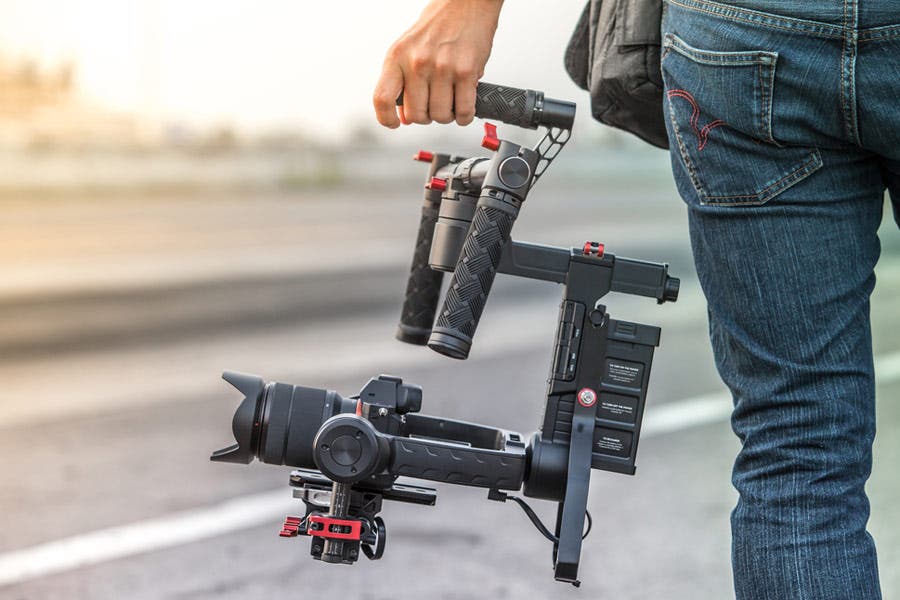 man holding professional video camera rig