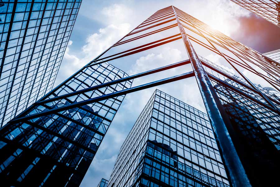 architectural photography shot of glassy buildings taken from below