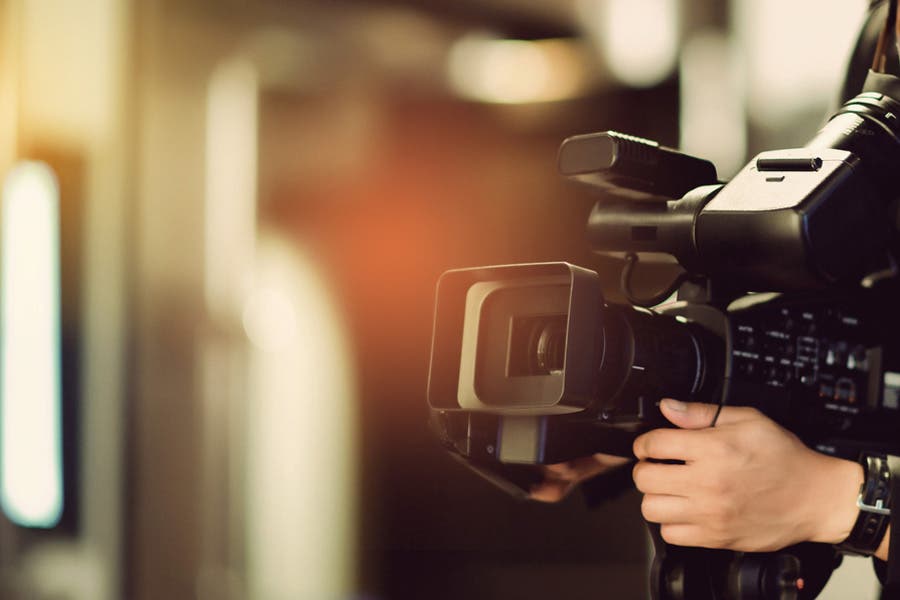 artistic shot of videographer’s camera