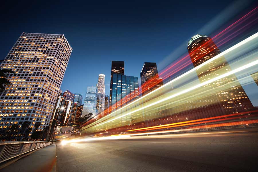 long exposure night shot of buildings and moving cars