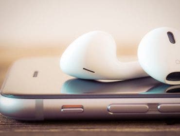 apple podcasts with headphones and iphone