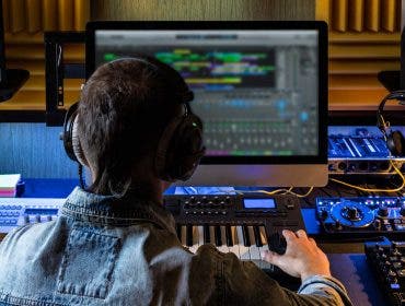 Music producer editing and mastering audio tracks