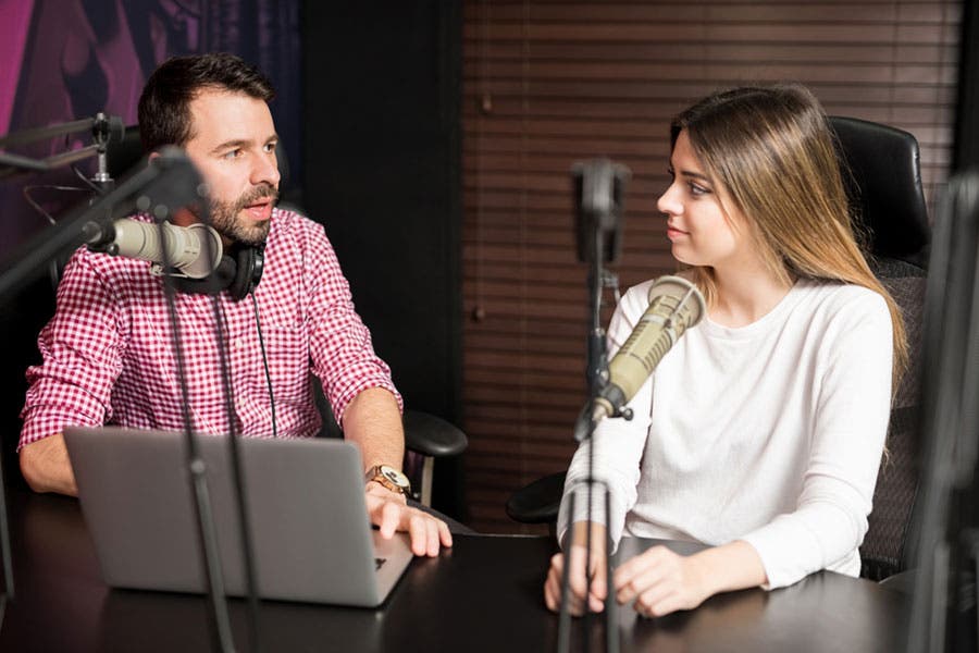 male and female podcasters during an interview