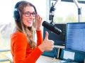 female podcaster doing a thumbs up