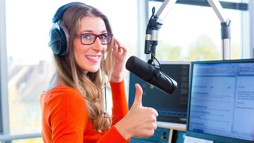 female podcaster doing a thumbs up