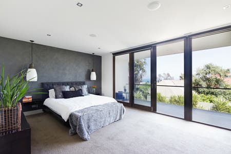 bedroom with big bright windows