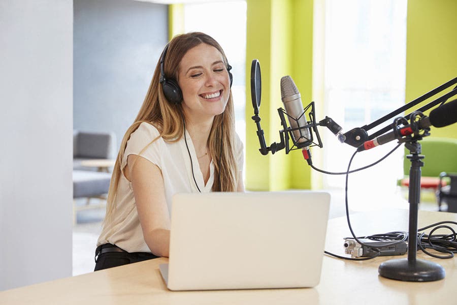 female podcaster having fun while recording