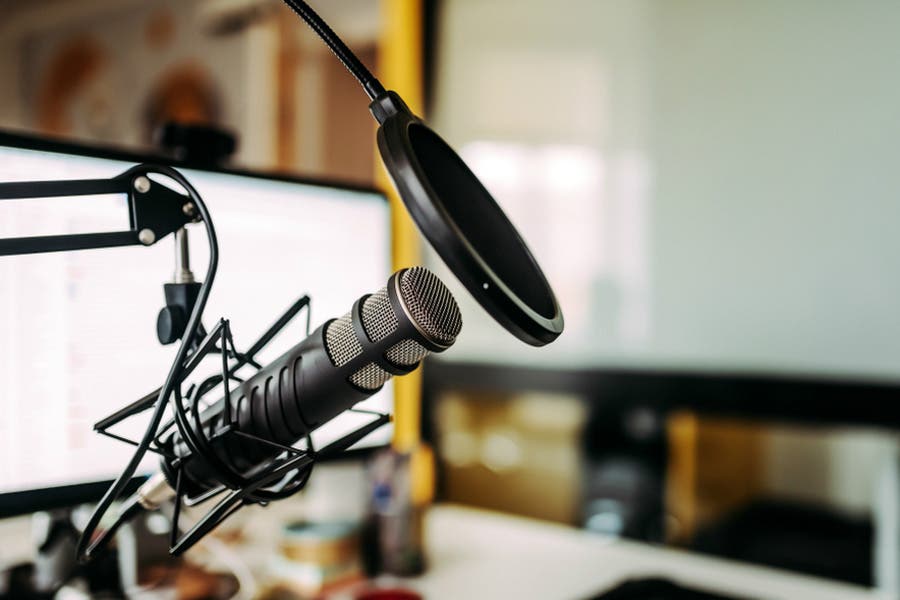 podcasting equipment made up of microphone, shock mount, and pop filter