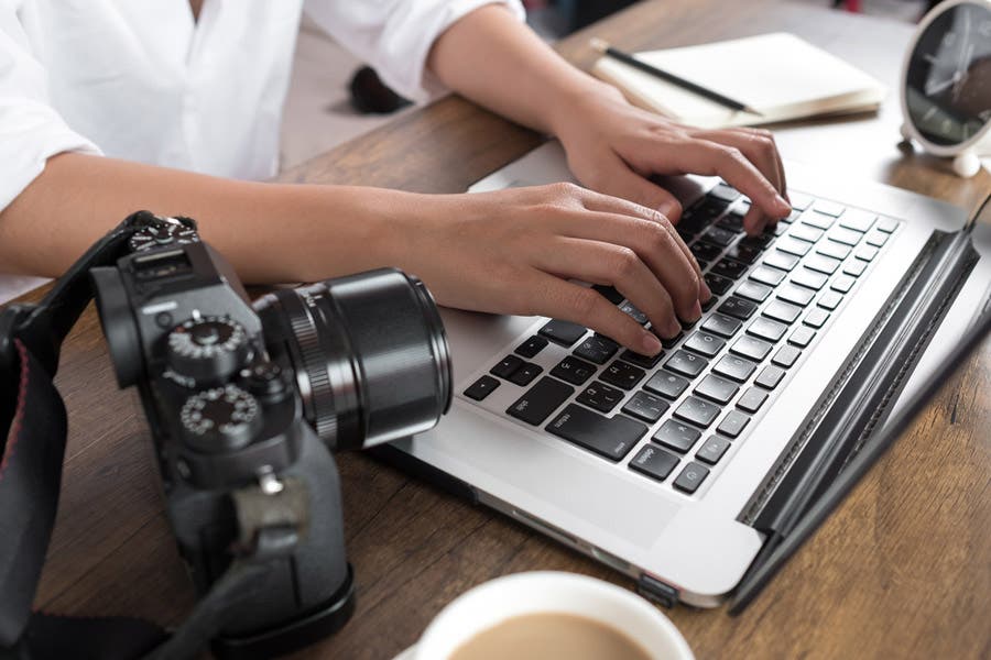 photographer working on laptop