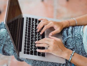woman working on apple macbook pro 13 laptop