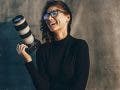 young woman photographer with a camera
