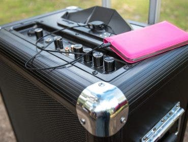 a portable PA system with a smartphone on top