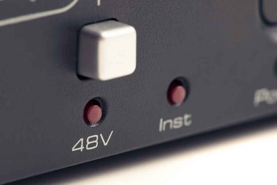 close up of 48V phantom power switch on a console