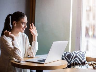 woman video calling laptop