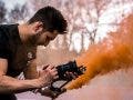 videographer capturing footage with 4k camera video