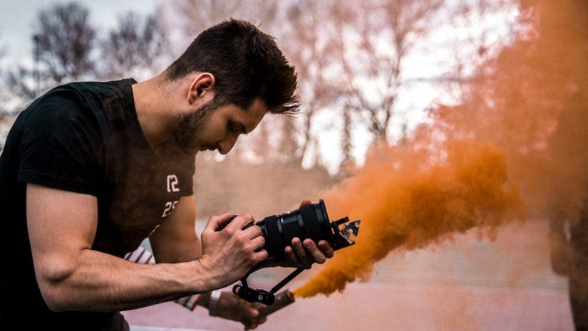 videographer capturing footage with 4k camera video