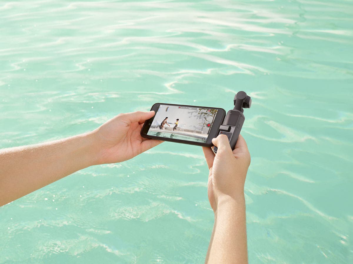 DJI Pocket 2 gimbal camera with smartphone in pool