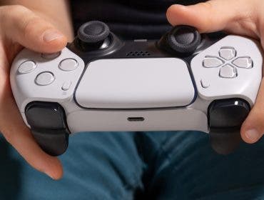 man playing ps5 sony playstation 5 controller best gaming consoles