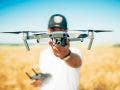 drone etiquette tips drone pilot with drone outdoors landscape