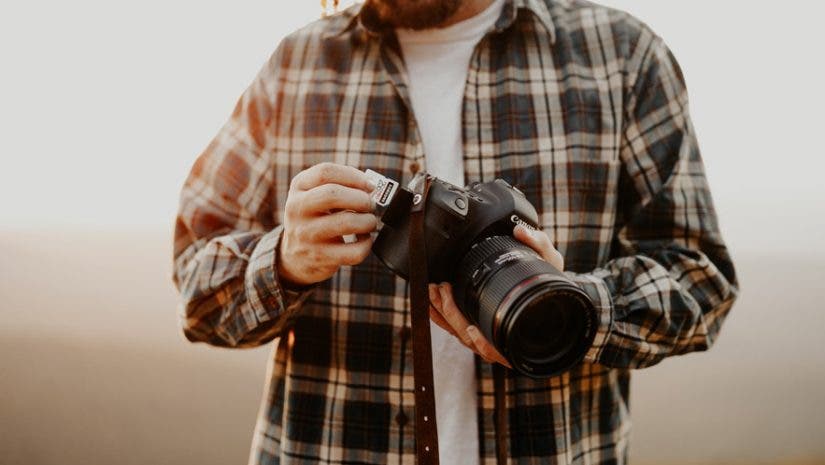 photographer with canon camera camera accessories for growing your photography skill