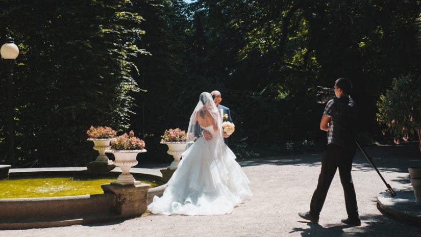 best zoom lenses for wedding video videographer with camera bride groom