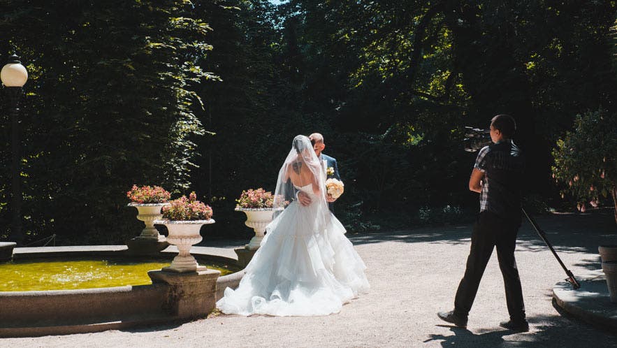 best zoom lenses for wedding video videographer with camera bride groom