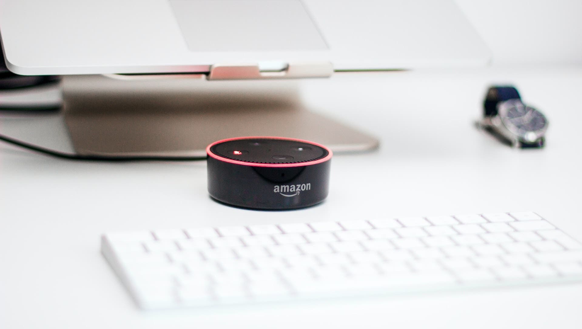 Amazon Echo Dot on a white desk