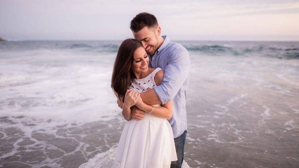 Couple hugs on the beach