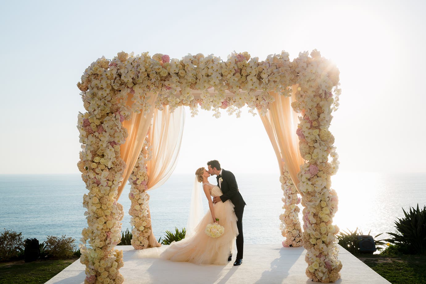 Groom dips the bride for a kiss