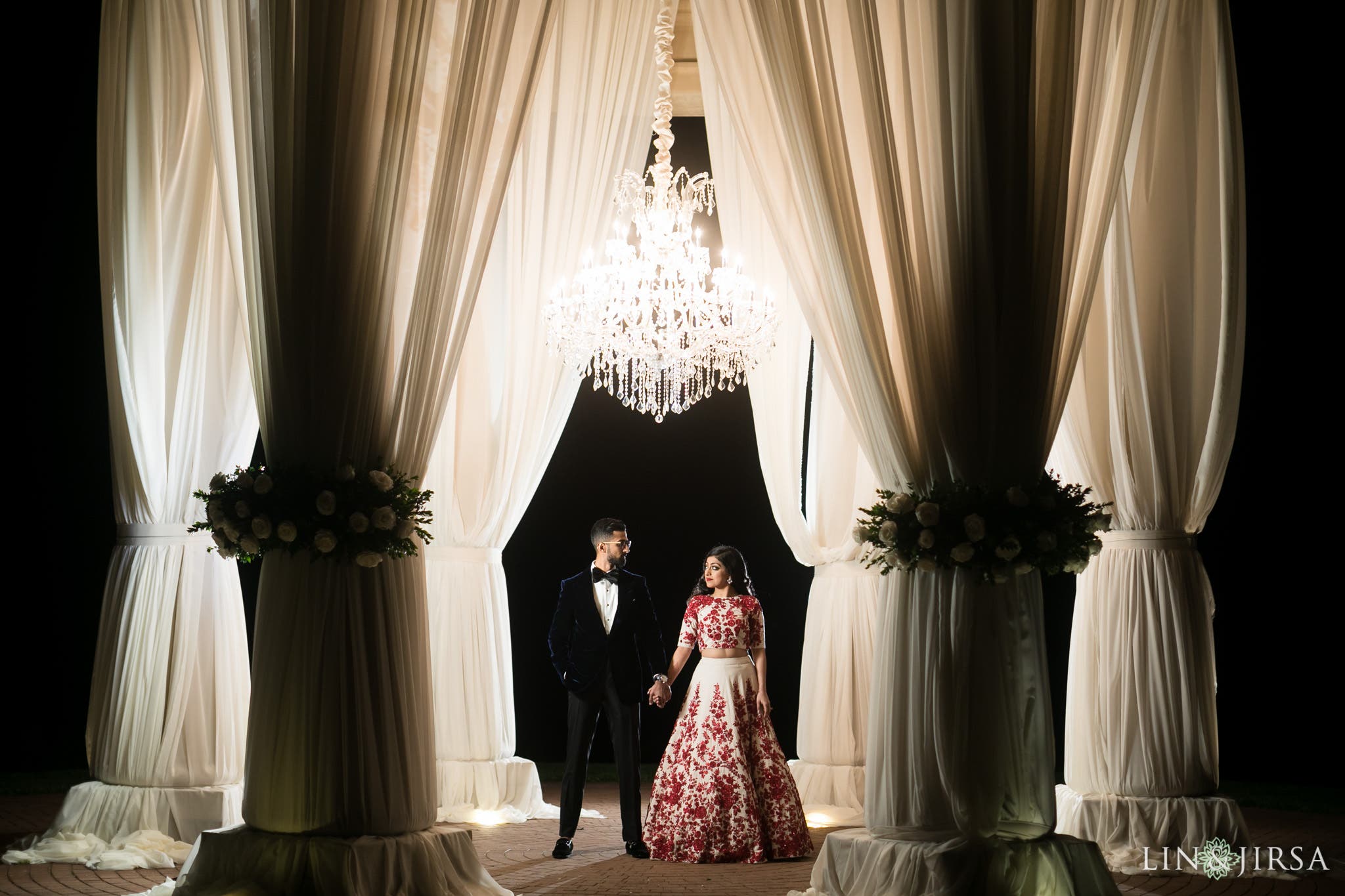 Couple stands in an open pose