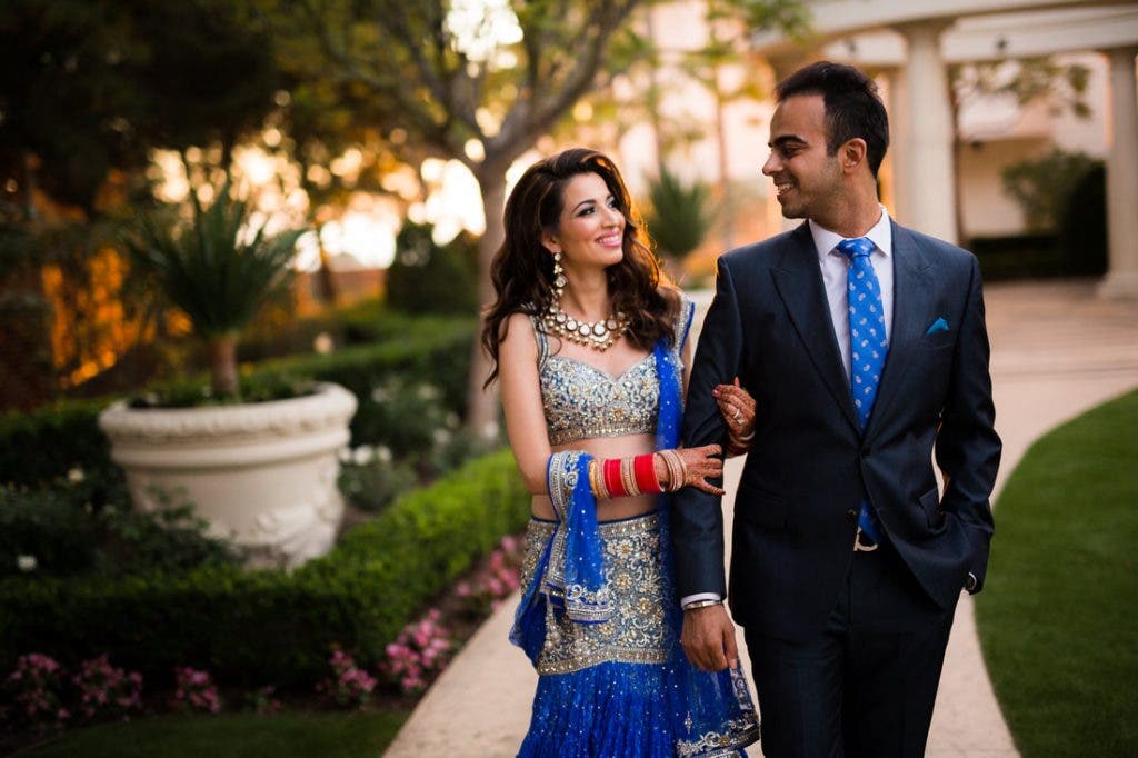 Couple walks during wedding portrait session