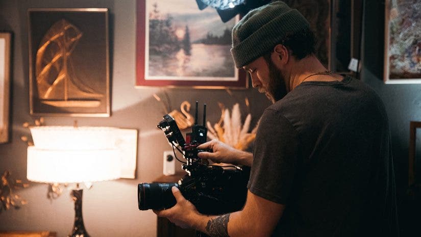 cinematographer filming a documentary