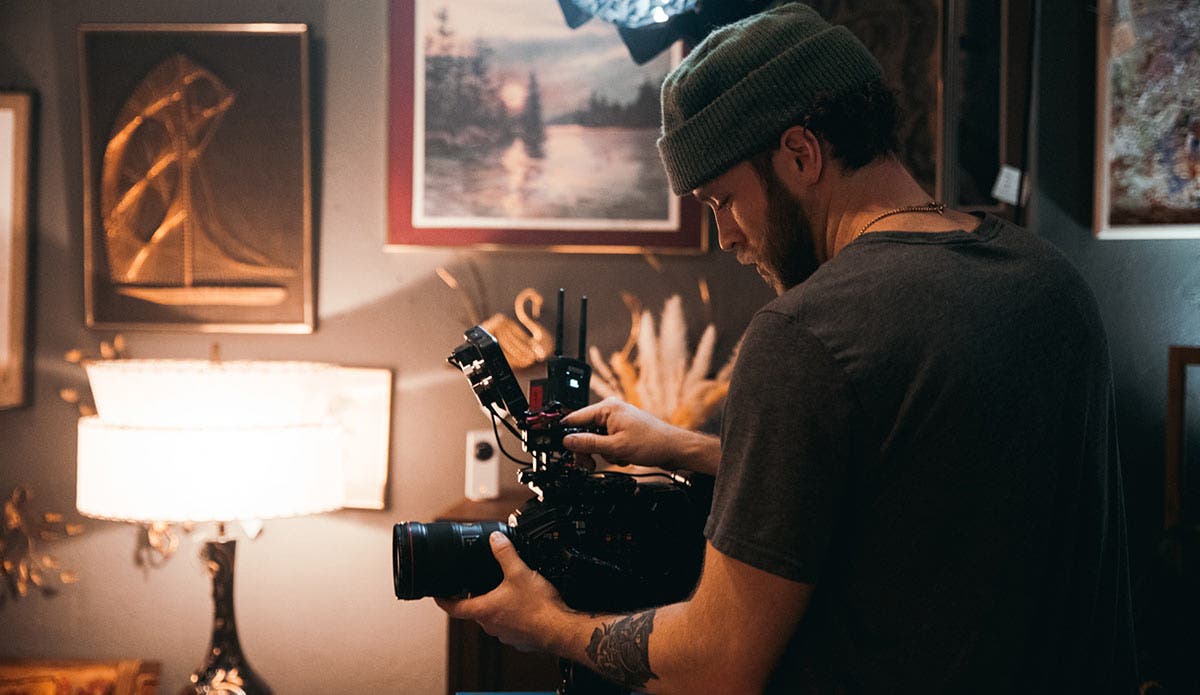 cinematographer filming a documentary
