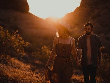 lens flare tips couple walking at sunset