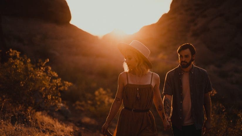 lens flare tips couple walking at sunset