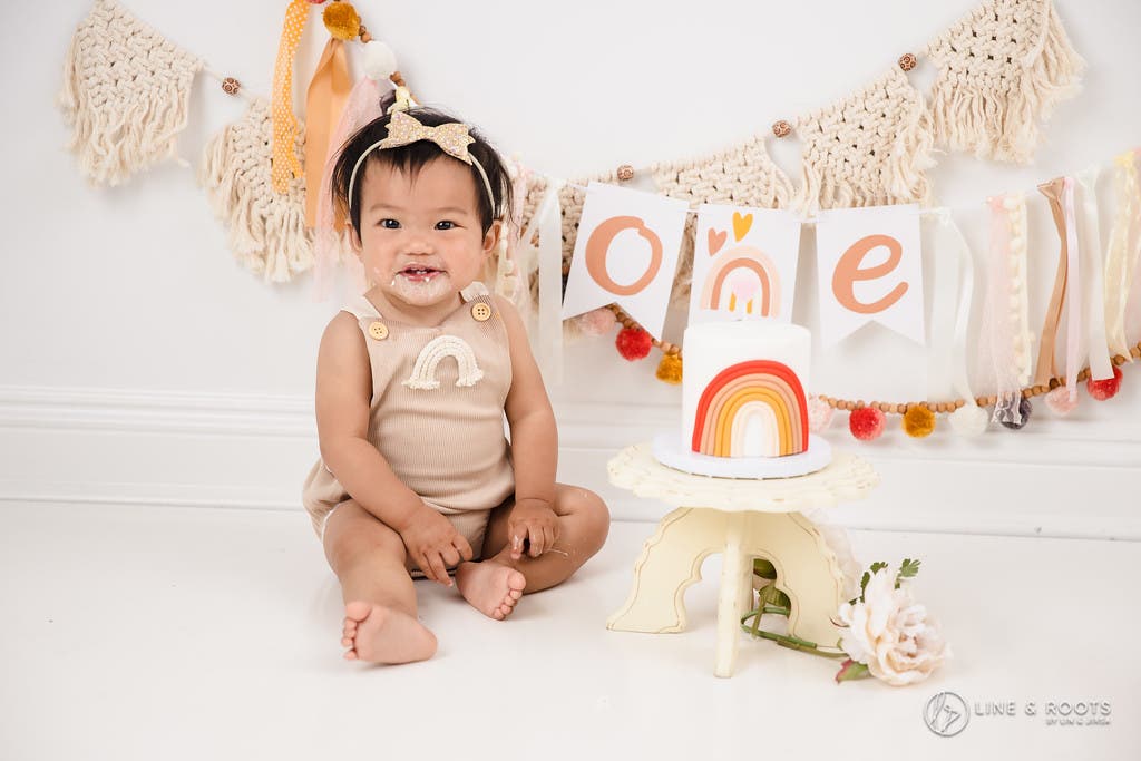 cake smash photos baby smiling
